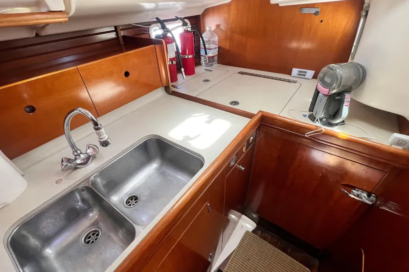 Slide: The Image of Interior view of 1996 Beneteau Oceanis 400 yacht kitchen with sink and appliances. - 12