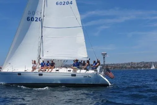 Slide: The Image of Sailboat Beneteau Oceanis 400, 1996 model, cruising with passengers on a sunny day. - 3