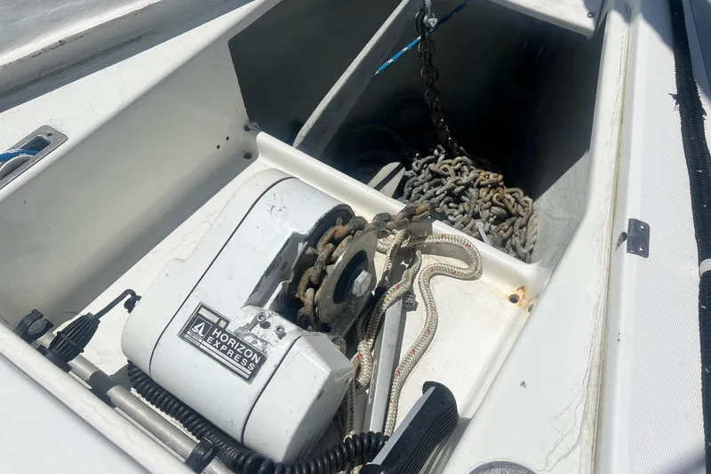 Slide: The Image of Anchor chain and winch on 1996 Beneteau Oceanis 400 sailboat deck. - 8