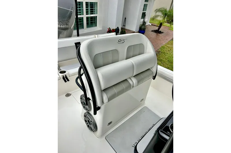 Slide: The Image of 2020 ShearWater 260 Carolina Flare boat dashboard with steering wheel and controls. - 11