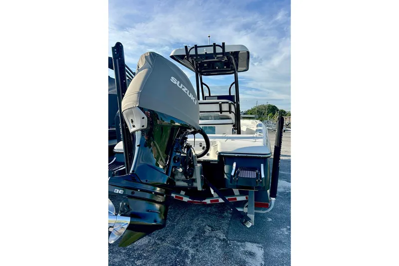 Slide: The Image of 2020 ShearWater 260 Carolina Flare boat on trailer in residential driveway. - 18