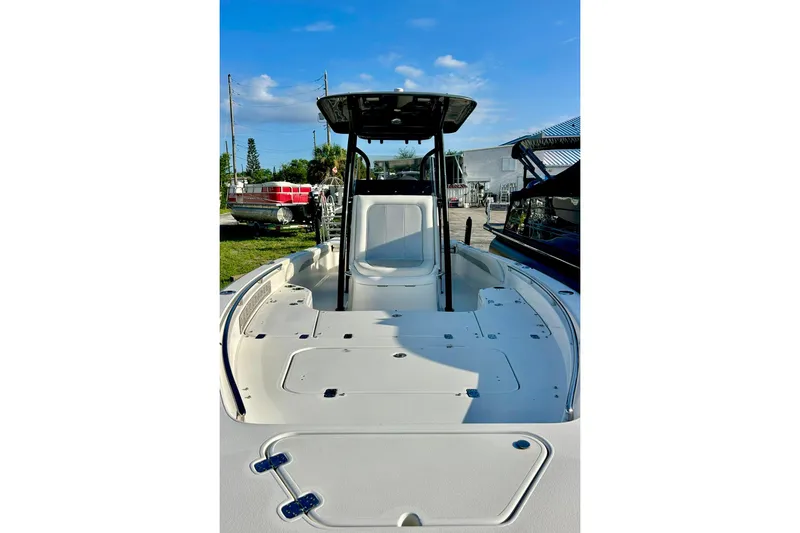 Slide: The Image of 2020 ShearWater 260 Carolina Flare boat, spacious deck, clear sky background. - 19