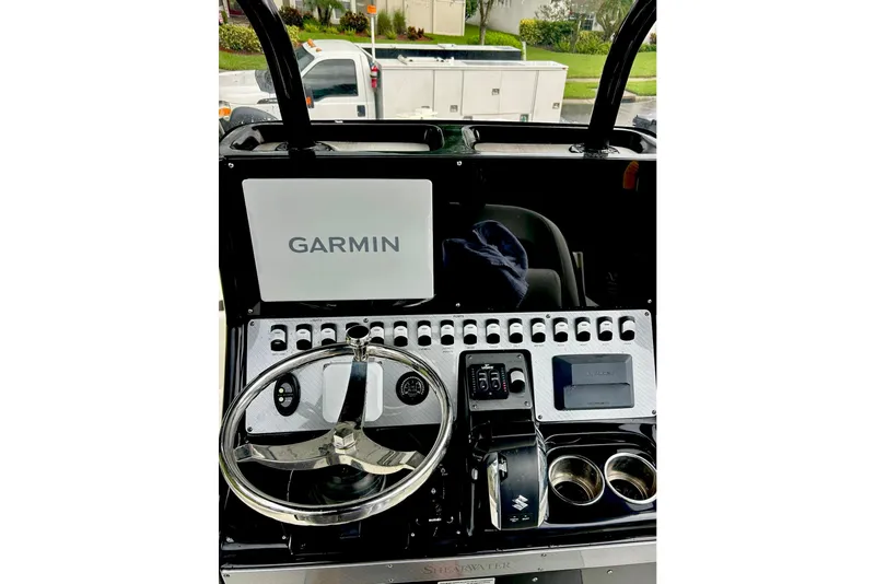 Slide: The Image of 2020 ShearWater 260 Carolina Flare boat dashboard with Garmin navigation system. - 30