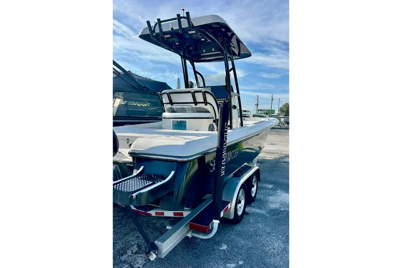 Slide: The Image of 2020 ShearWater 260 Carolina Flare boat on trailer, rear view, clear sky background. - 32
