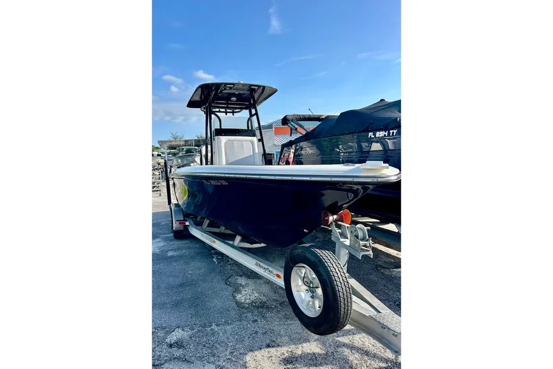 Slide: The Image of 2020 ShearWater 260 Carolina Flare boat on trailer, sunny day, clear sky. - 33