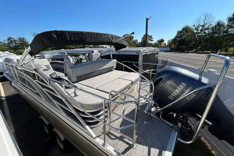 Slide: The Image of 2023 Bennington L 23 Swingback pontoon boat with Yamaha engine, parked outdoors. - 14