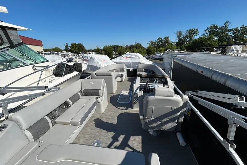 Slide: The Image of 2023 Bennington L 23 Swingback pontoon boat with spacious seating and modern design. - 18