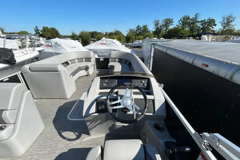 Slide: The Image of 2023 Bennington L 23 Swingback pontoon boat with spacious seating and modern helm. - 19