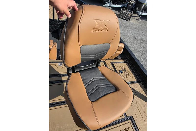 Slide: The Image of Brown and gray seat of 2026 Xpress X19 Pro boat, featuring embossed logo. - 10