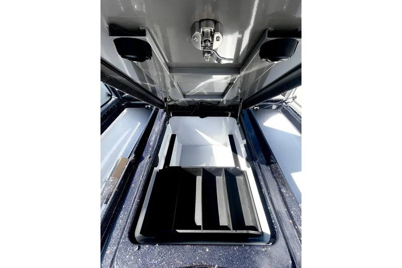 Slide: The Image of Open storage compartment in 2026 iKon VLE20 vehicle, showcasing interior design and organization. - 4