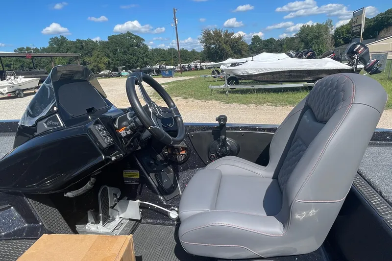 Slide: The Image of Interior of 2026 iKon VLE20 boat with steering wheel and gray seat. - 6