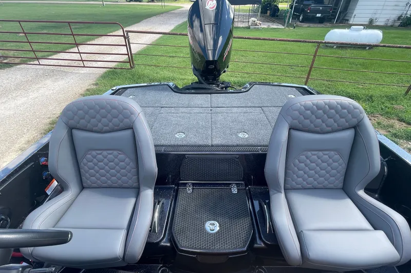 Slide: The Image of iKon VLE20 2026 boat interior with two gray seats and rear motor view. - 8