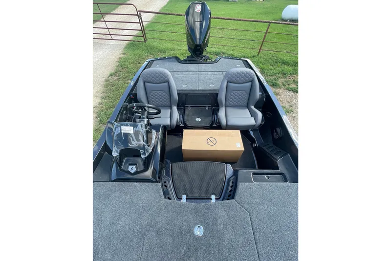 Slide: The Image of 2026 iKon VLE20 boat interior with two seats and a cardboard box. - 9