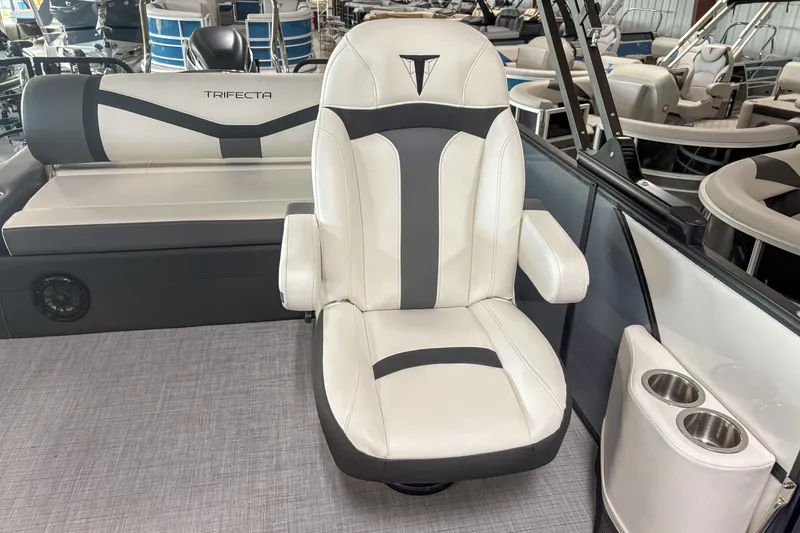 Slide: The Image of Luxury seating on 2026 Trifecta 24UL CS boat, featuring sleek design and cup holders. - 10