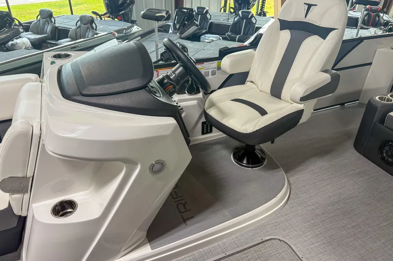 Slide: The Image of Captain's seat and helm of 2026 Trifecta 24UL CS pontoon boat, featuring modern design. - 11
