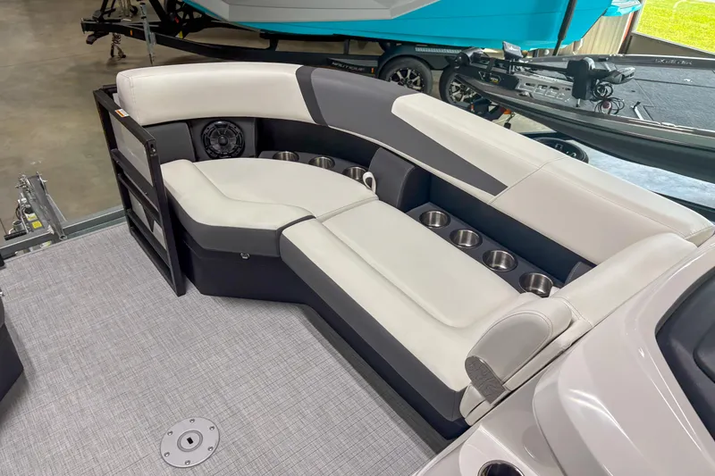 Slide: The Image of Luxurious seating area on 2026 Trifecta 24UL CS boat with cup holders and speaker. - 8