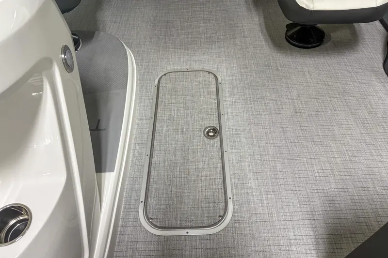 Slide: The Image of 2026 Trifecta 24UL CS boat interior with sleek flooring and storage hatch. - 9