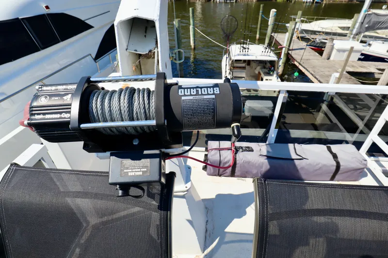 Slide: The Image of Boat deck with winch system, Fun Country Forerunner 1997, docked at marina. - 10