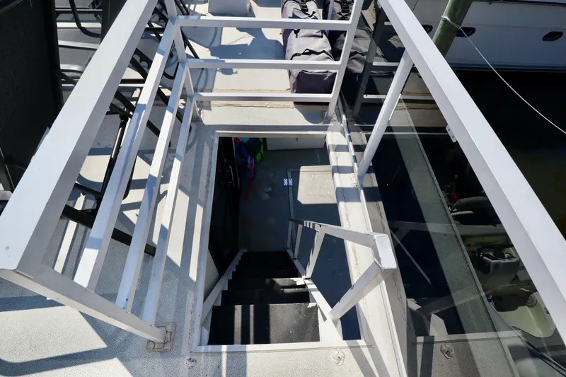 Slide: The Image of Staircase on a 1997 Fun Country Forerunner boat, leading below deck. - 13