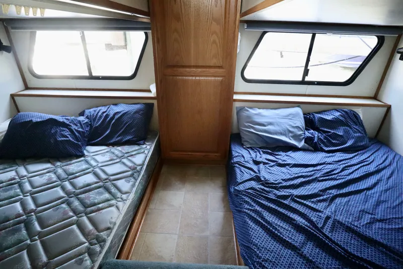 Slide: The Image of Interior of 1997 Fun Country Forerunner with two beds and windows. - 25