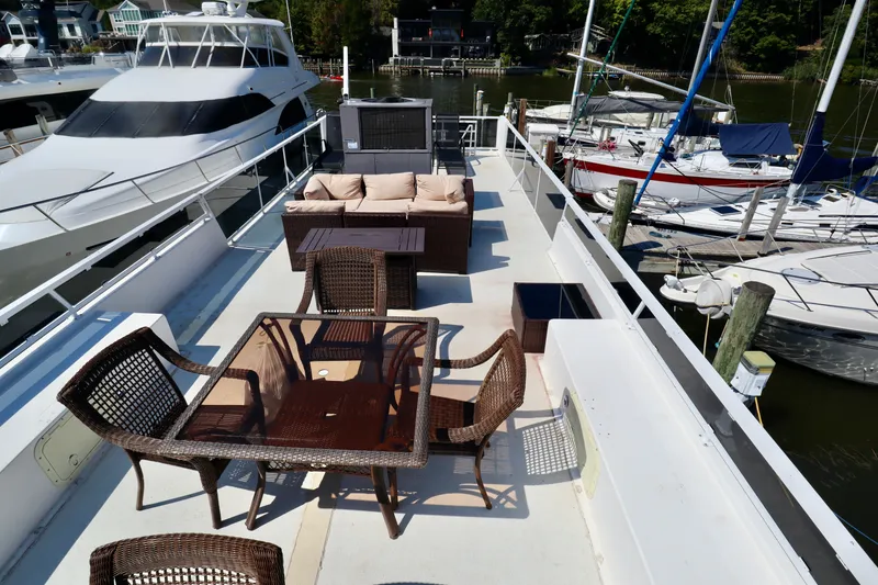 Slide: The Image of Upper deck of 1997 Fun Country Forerunner houseboat with outdoor seating and dining area. - 3