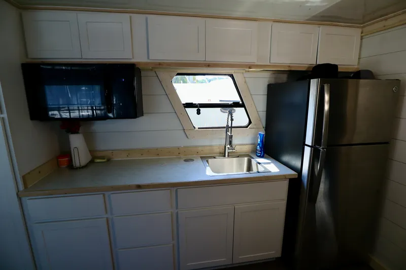Slide: The Image of Modern kitchen in 1997 Fun Country Forerunner houseboat with stainless steel appliances and sleek cabinetry. - 36