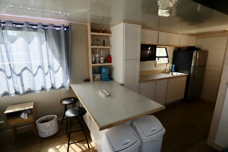 Slide: The Image of Compact kitchen in 1997 Fun Country Forerunner, featuring modern appliances and natural light. - 38