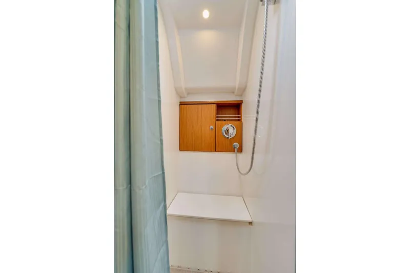 Slide: The Image of Shower area in 2016 Bavaria 51 Cruiser yacht with wooden storage and modern fixtures. - 10