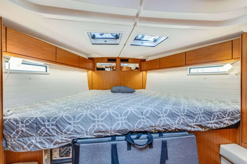 Slide: The Image of Interior cabin of 2016 Bavaria 51 Cruiser yacht with cozy bed and wooden finish. - 18