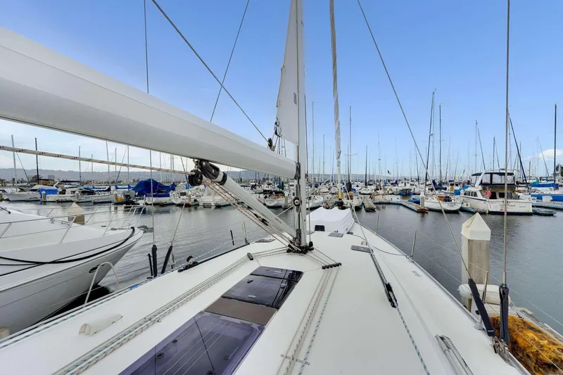 Slide: The Image of Sailing yacht Bavaria 51 Cruiser 2016 docked in a marina, surrounded by boats. - 3