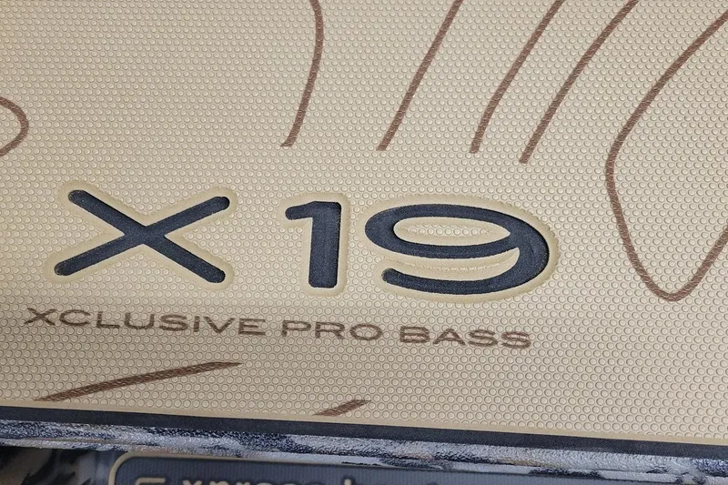 Slide: The Image of Xpress X19 Pro 2026, Xclusive Pro Bass logo on textured surface. - 6