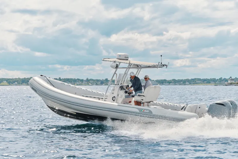 The Image of 2014 AB Inflatables Oceanus 28 VST cruising on open water under a cloudy sky. - 0