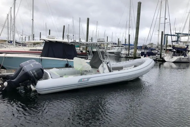Slide: The Image of 2014 AB Inflatables Oceanus 28 VST boat docked in a marina with overcast skies. - 5