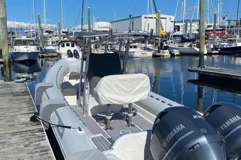 Slide: The Image of 2014 AB Inflatables Oceanus 28 VST boat docked with Yamaha engines in a marina. - 7