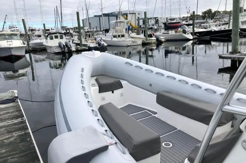 Slide: The Image of 2014 AB Inflatables Oceanus 28 VST boat docked in a marina with other vessels. - 9