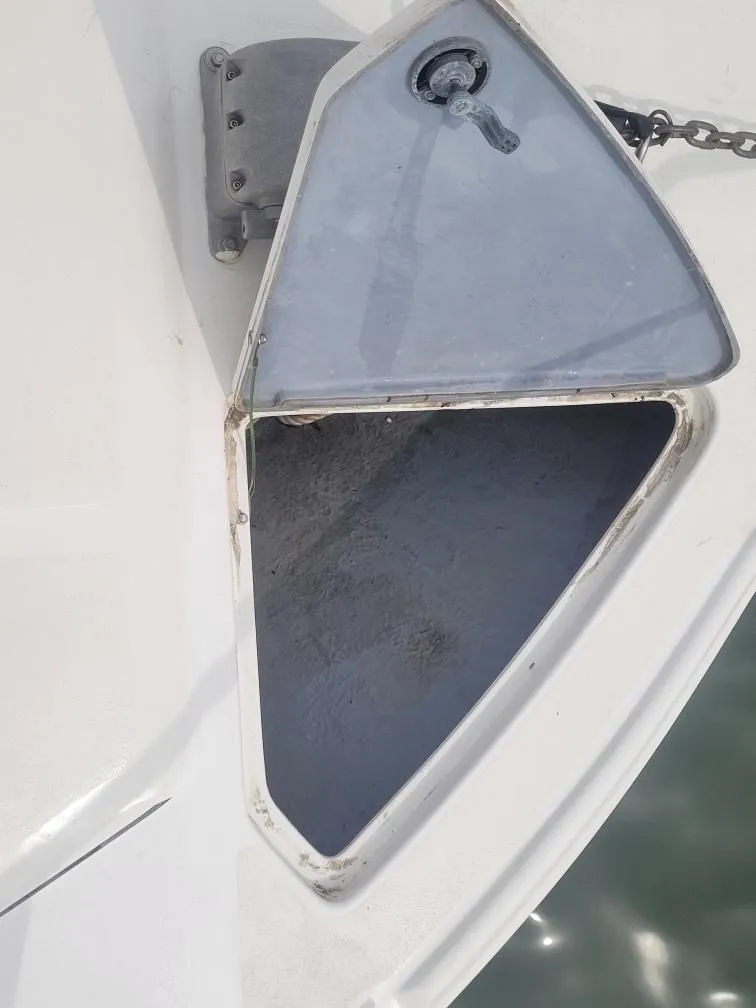 Slide: The Image of Open anchor locker on 1992 Sea Ray 310 Sport Bridge boat. - 15