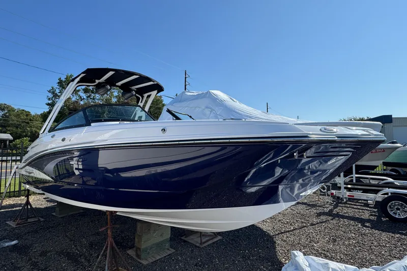 Slide: The Image of 2026 Monterey M-65 boat with sleek design on display outdoors. - 1