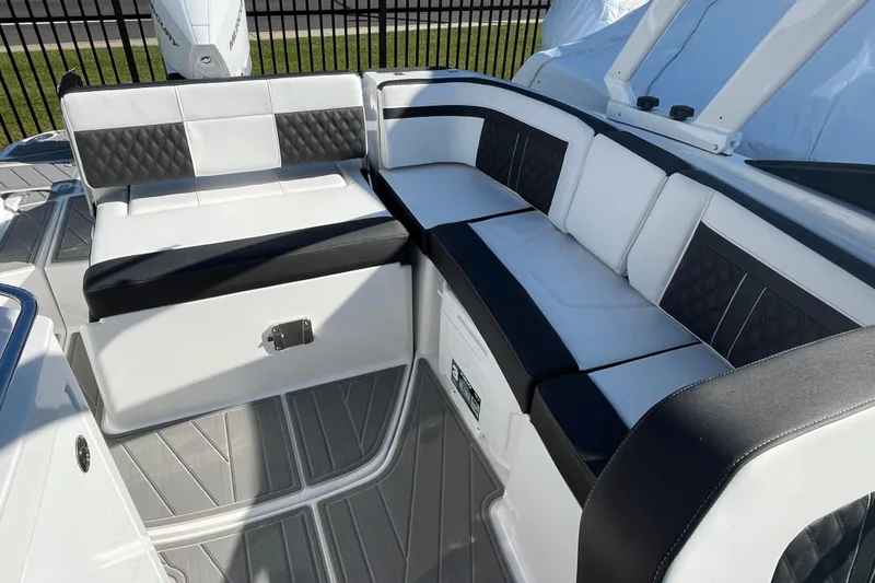Slide: The Image of Luxurious seating on 2026 Monterey M-65 boat, featuring black and white upholstery. - 10