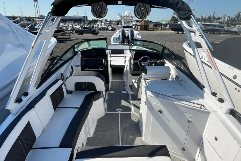 Slide: The Image of 2026 Monterey M-65 boat interior with sleek seating and modern dashboard design. - 13