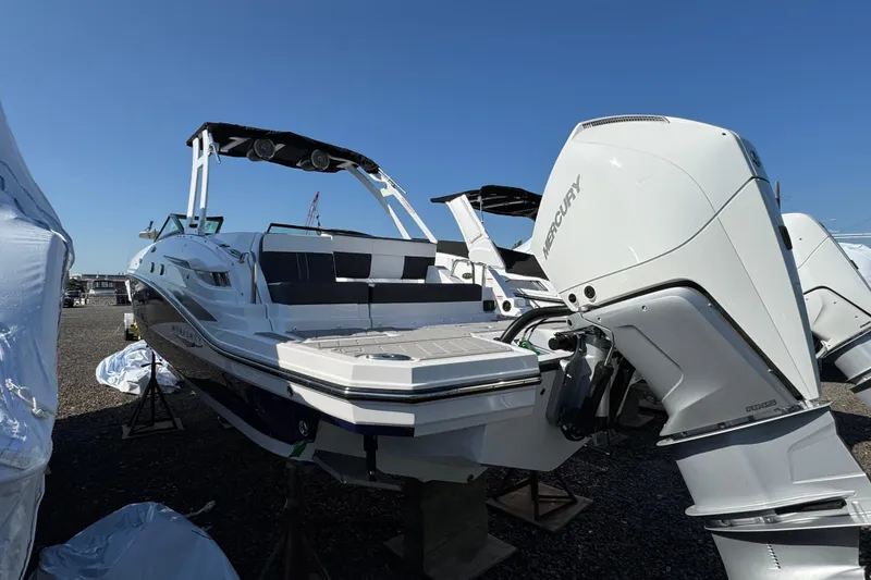 Slide: The Image of 2026 Monterey M-65 boat with Mercury outboard engines, displayed outdoors. - 3