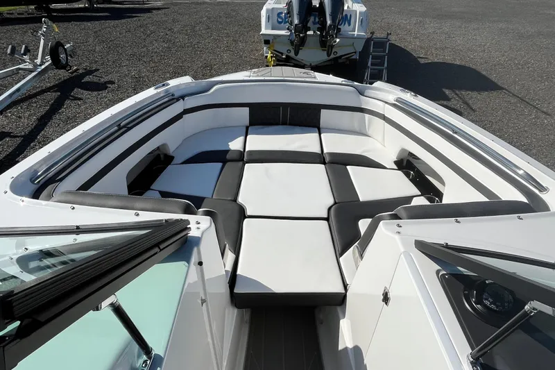Slide: The Image of 2026 Monterey M-65 boat interior with sleek black and white seating arrangement. - 8