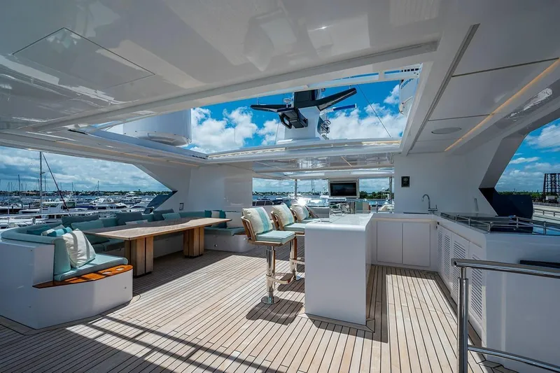 Slide: The Image of Luxurious 2020 Majesty 140 yacht deck with modern seating and open sky view. - 14