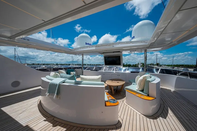 Slide: The Image of Luxurious 2020 Majesty 140 yacht deck with elegant seating and ocean view. - 15