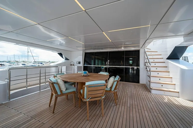 Slide: The Image of Spacious deck of 2020 Majesty 140 yacht with wooden furniture and modern design. - 20