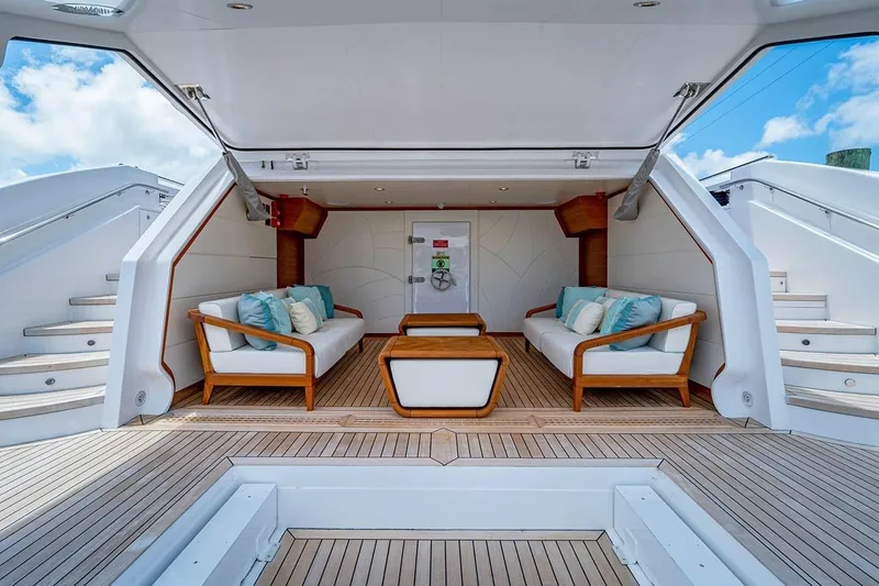 Slide: The Image of Luxurious 2020 Majesty 140 yacht interior with elegant seating and wooden accents. - 21