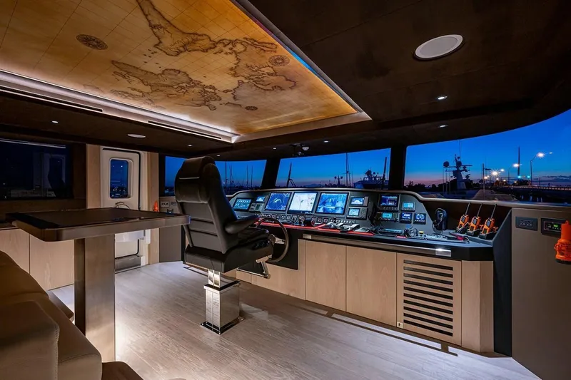 Slide: The Image of Luxurious 2020 Majesty 140 yacht cockpit with advanced navigation systems and elegant interior design. - 33