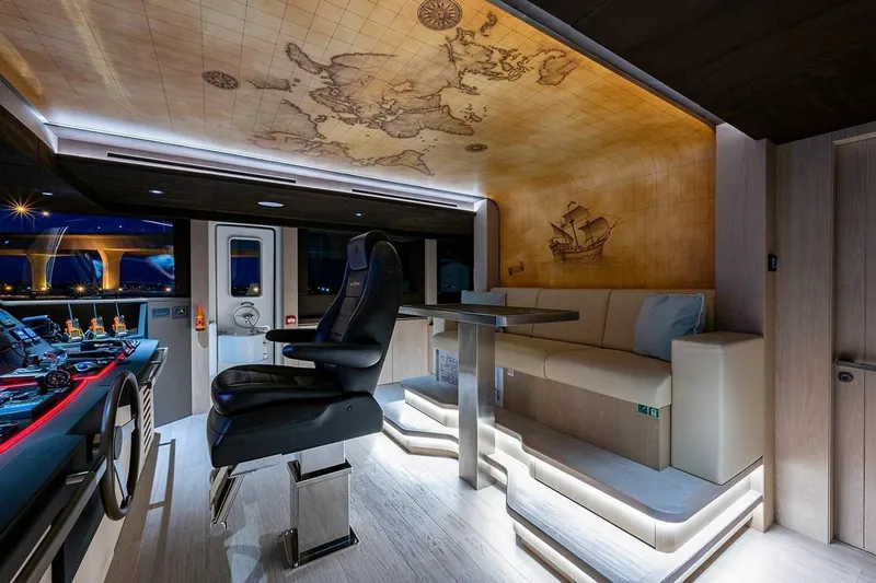 Slide: The Image of Luxurious 2020 Majesty 140 yacht interior with map ceiling and modern seating. - 34