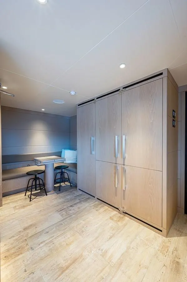 Slide: The Image of Modern interior of 2020 Majesty 140 yacht with seating and storage. - 36