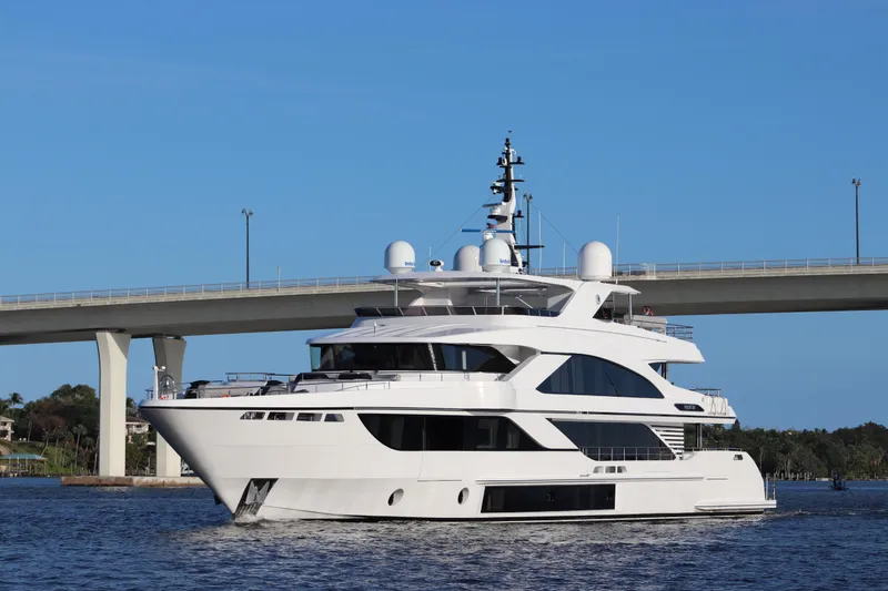 Slide: The Image of Luxury Majesty 140 yacht cruising under a bridge, 2020 model. - 4