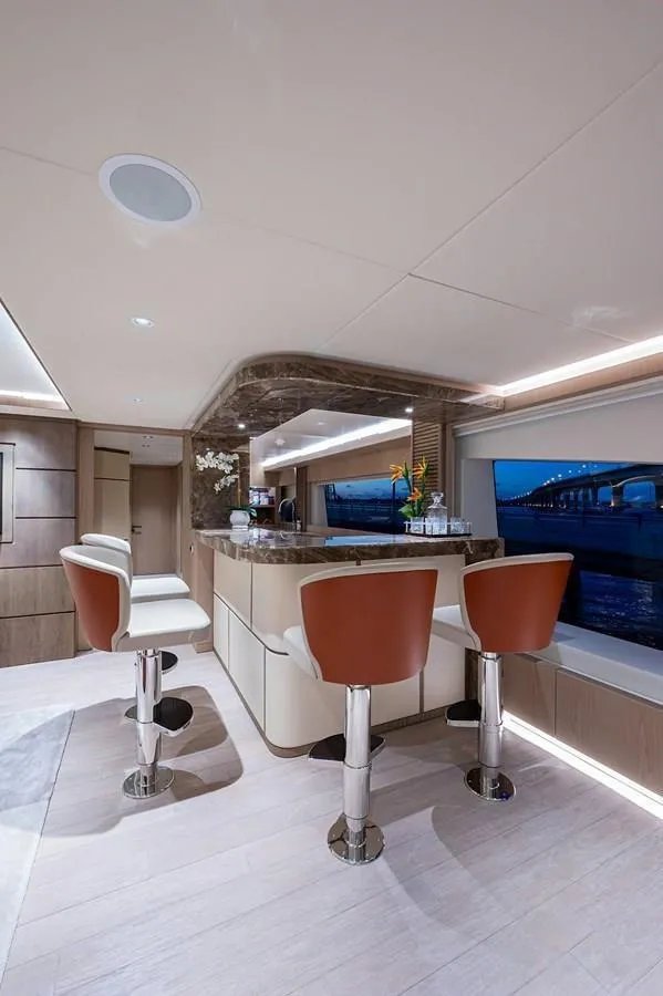 Slide: The Image of Luxurious interior of 2020 Majesty 140 yacht with elegant bar and seating. - 41